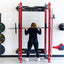 woman using red full cage with folding storage feature