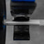 Close-up of a barbell with weight plates on a blurred background