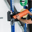 Large PRx Junk Drawer mounted on a squat rack. Man placing orange foam roller onto drawer.