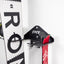 close up of wall mounted ski and snowboard storage with snowboard and skis stored