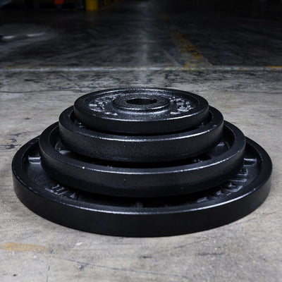 stacked set of cast iron Olympic plates.