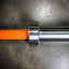 Knurling and sleeve of bright orange cerakote bar