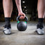 Athlete putting down kettlebell